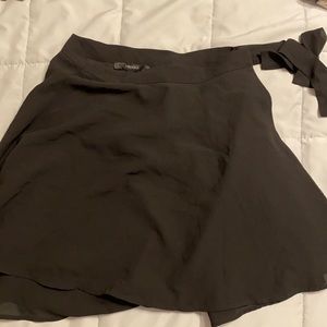 flowy, wrap around, black skirt.